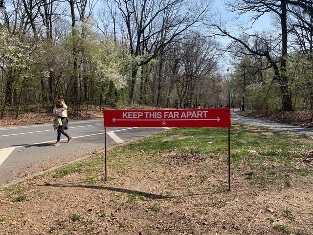 A sign in Prospect Park reminds people of the 6-foot rule